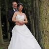 Image of a Bride and Groom next to trees